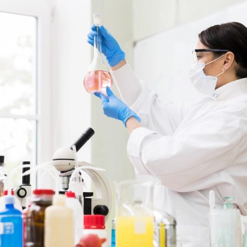 medium-shot-woman-holding-balloon-flask
